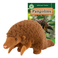 Plush pangolin toy with a book titled 'Pangolins' in the background