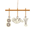 Sea otter, Sea Urchin, and Seaweed ornaments on a wooden dowel.